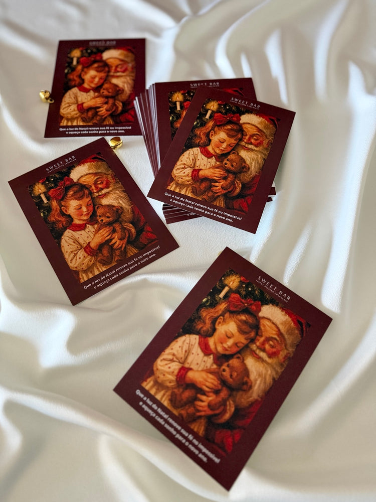Cartão de Natal bordô Sweet Bar sobre tecido branco